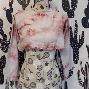 A tie-dyed crop top long sleeved